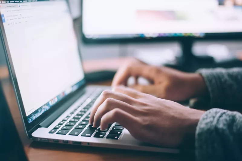 Image: a person typing on a laptop can have a big affect on a business.