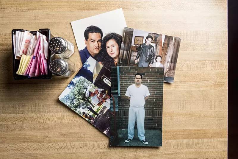 Image: Photos of Edward Sotelo are scattered on a table at Tia's on the Bluff restaurant. Sotelo is serving a life sentence for drug trafficking.