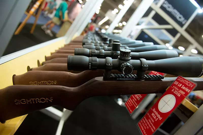 Image: Rifle scopes on display inside the National Rifle Association annual meeting in Dallas in May 2018.