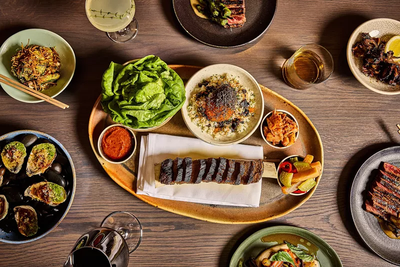 Image: One of the unique offerings from Uchiko is a bone-in short rib for the table served with sides.