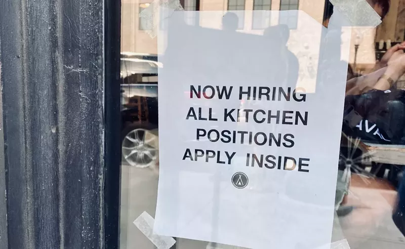 Image: A sign in the window at Tribal All Day Cafe in the Bishop Arts District.