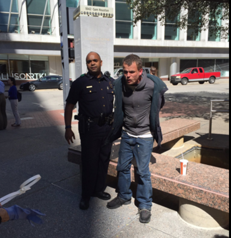 Image: A panhandler arrested during a periodic crackdown.