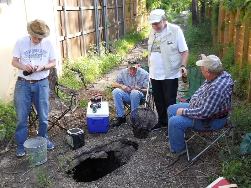 Image: This has to be a scene from Detroit, right? Oh my gosh, no, those are my neighbors in the alley right behind my house fishing in a pothole in East Dallas. So, you know, we might want to hold back on the bragging for now.