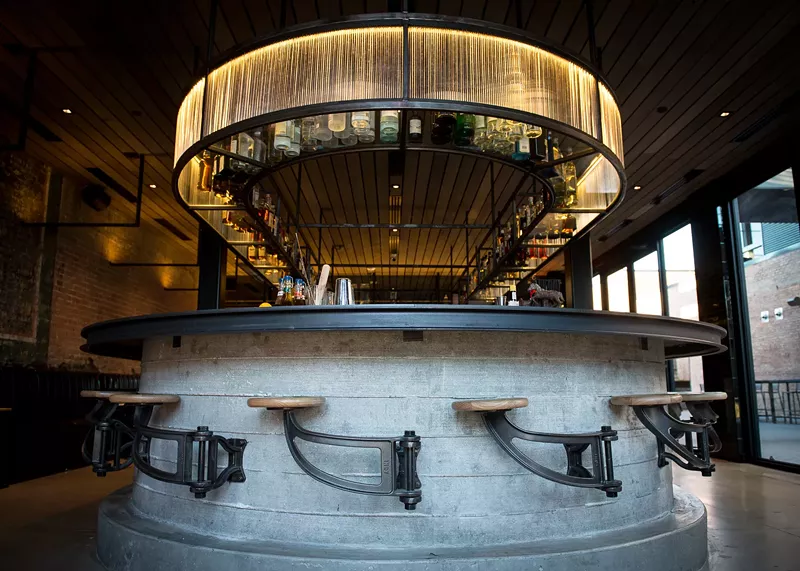 Image: The bar seats at Harlowe MXM seem to levitate using an iron hinge.