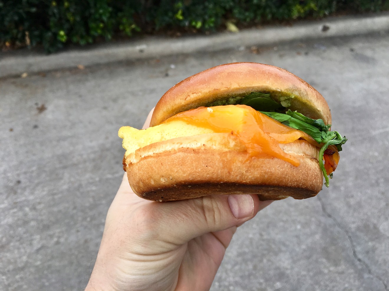 The breakfast sandwich at White Rock Coffee — bacon, egg, cheese, spinach and a pesto spread on a brioche bun — will set you back $4.25.