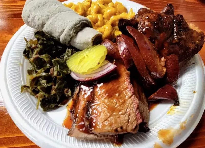 Image: A three meat plate with awaze sausage, chicken and brisket.