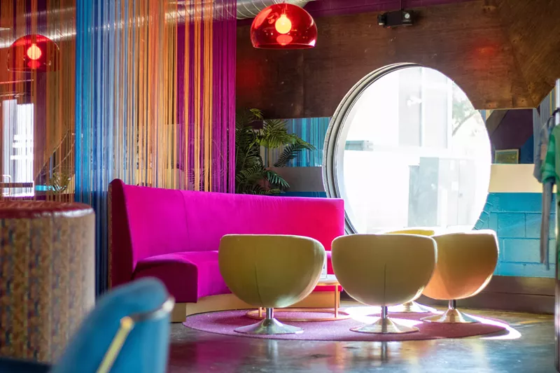 Image: Psychedelic pinks, blues and yellows greet guests as they enter the decked-out 2,700-square-foot record bar Vinyl Lounge.