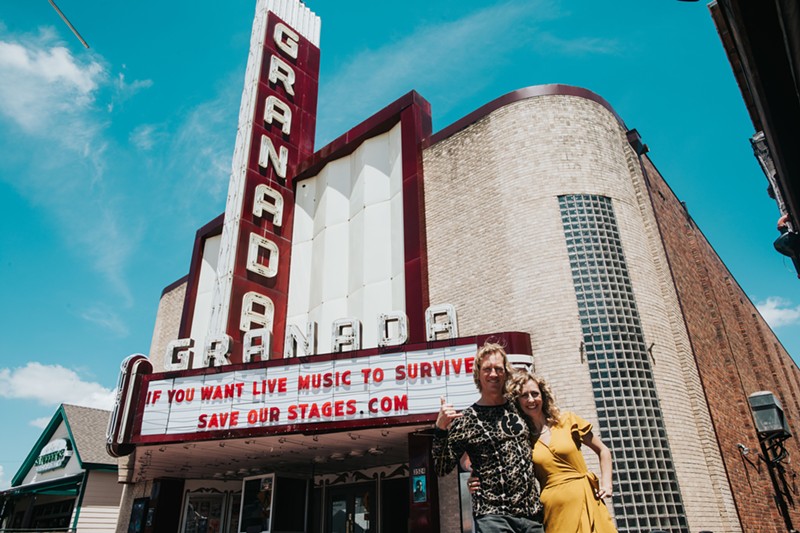 Owners Mike Schoder and Julia Garton stand in front of their venue, The Granada Theater, which was built in 1946.