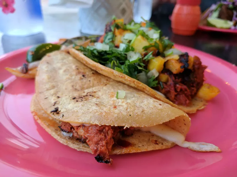 Image: The choriqueso (front) and chicken pastor (back) at Taquero.