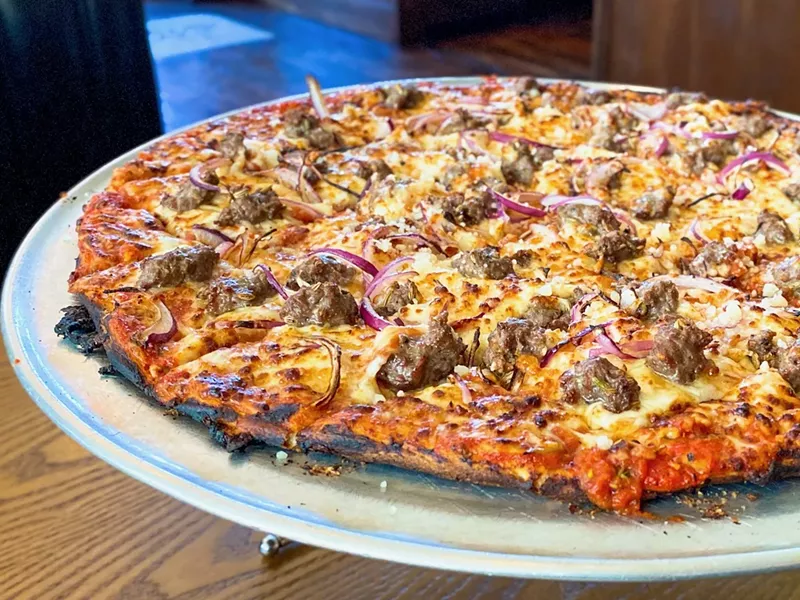 Image: The tavern-style pizza at DL Mack's is legit even if the space is a bit more upscale.