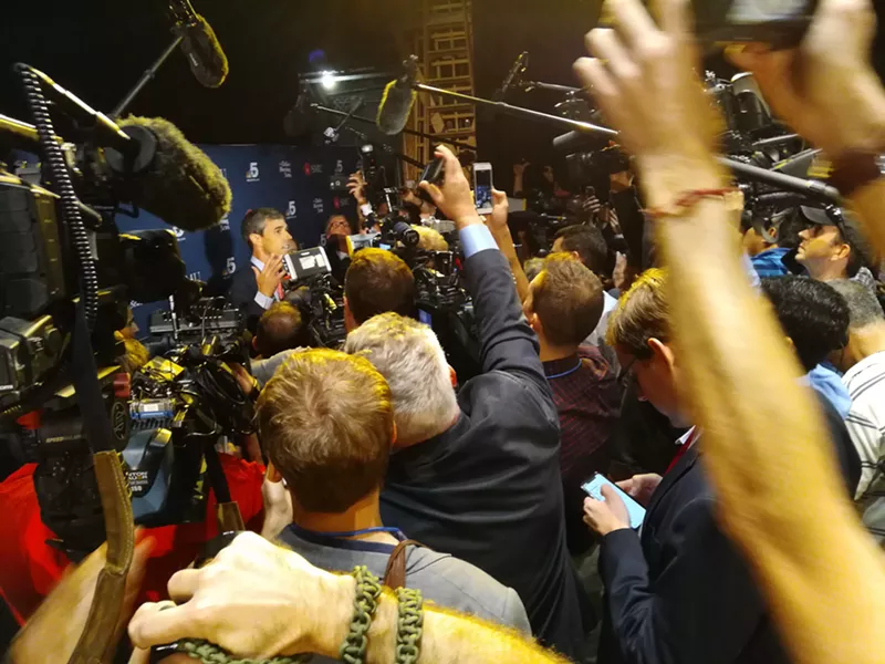 Image: U.S. Rep. Beto O'Rourke, in the middle of an intense media scrum after his U.S. Senate debate with Sen. Ted Cruz