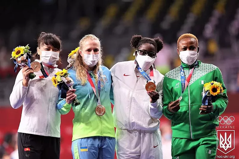 Image: Tamyra Mensah-Stock, second from right, became the first African American woman to win an Olympic gold medal last year.