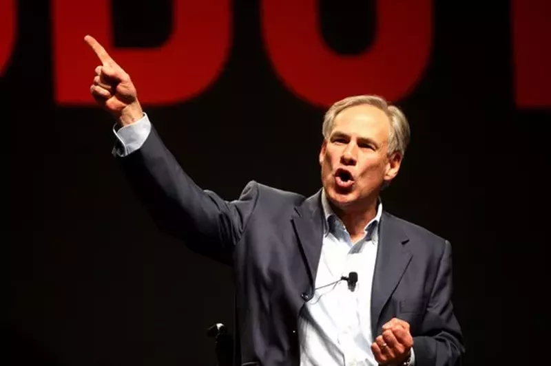 Image: Texas Gov. Greg Abbott, now, somehow, hanging out on Lt. Gov. Dan Patrick's right.