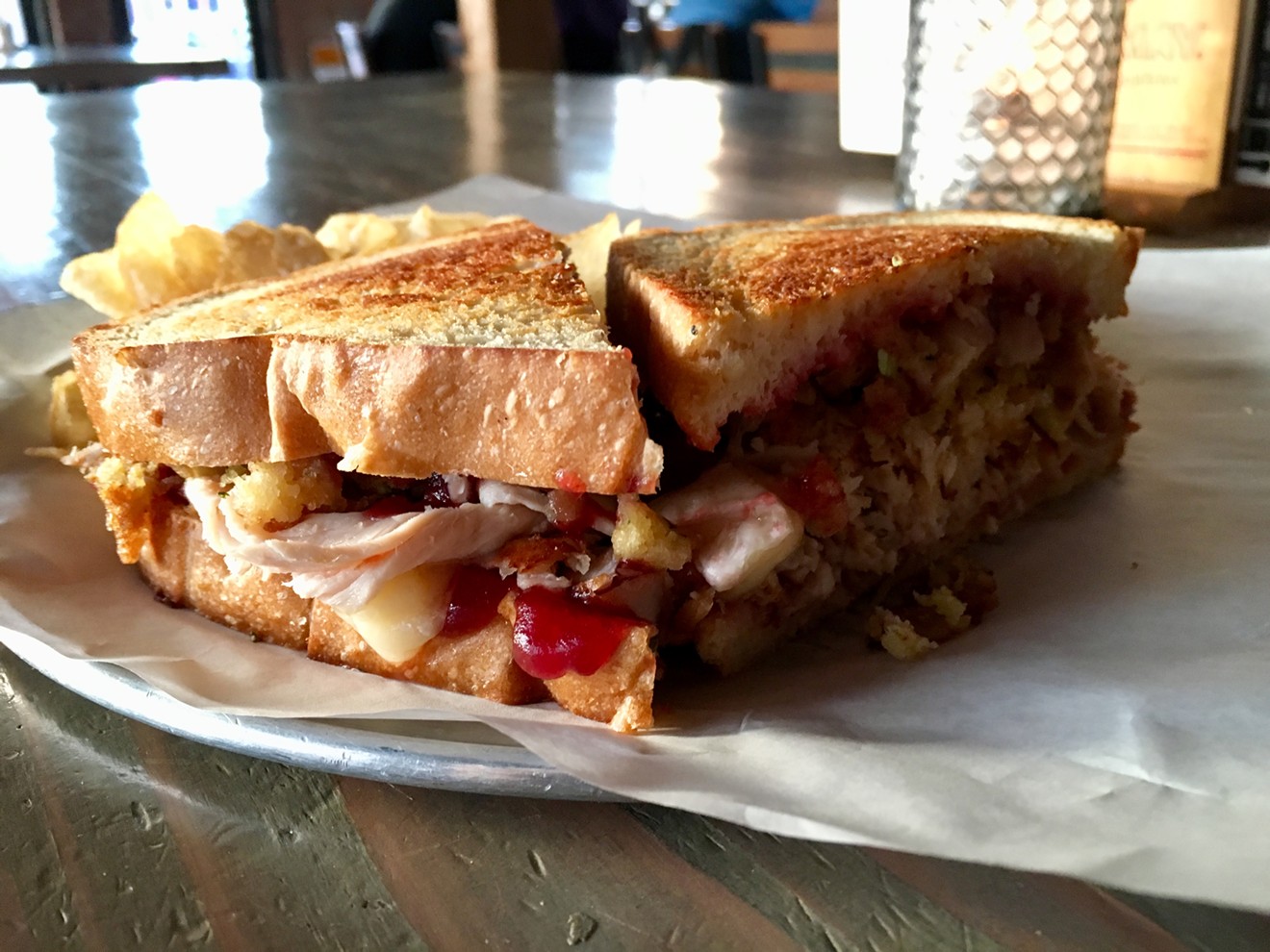 Deep Ellum's Cold Beer Co. is running a special: the leftovers sandwich, with hickory-smoked turkey, stuffing, brie and cranberry sauce for $12.