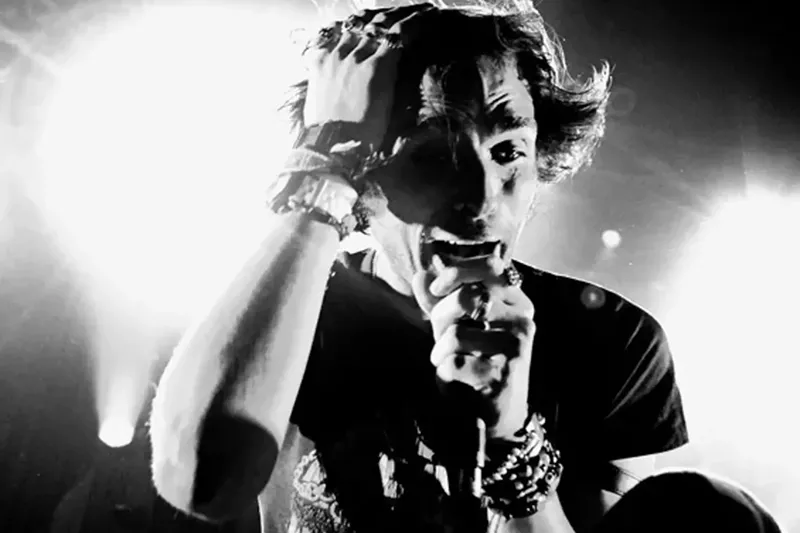 Image: Man singing on stage