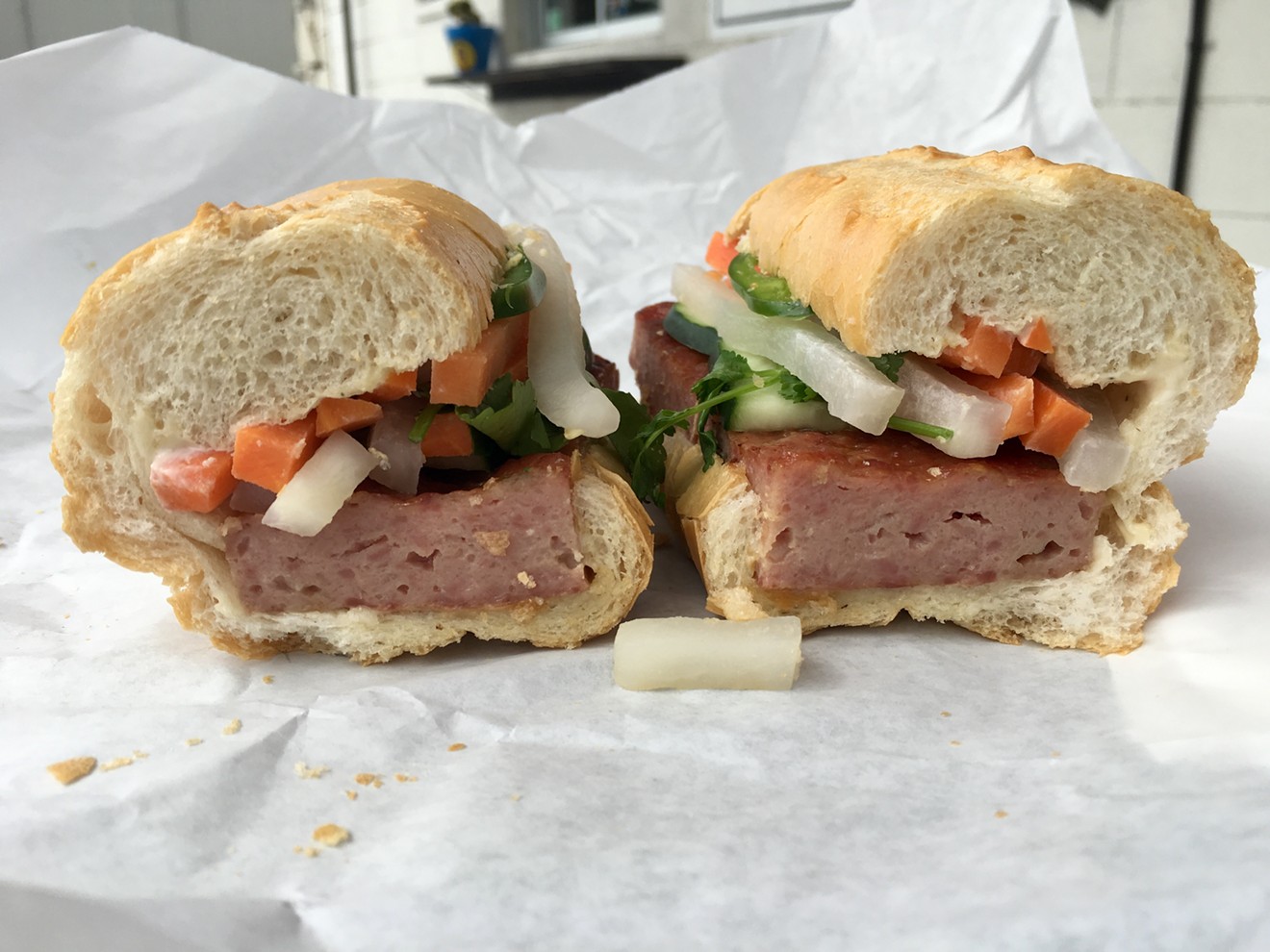 The garlicky pork banh mi features a sausage patty that's ground in house for $9.