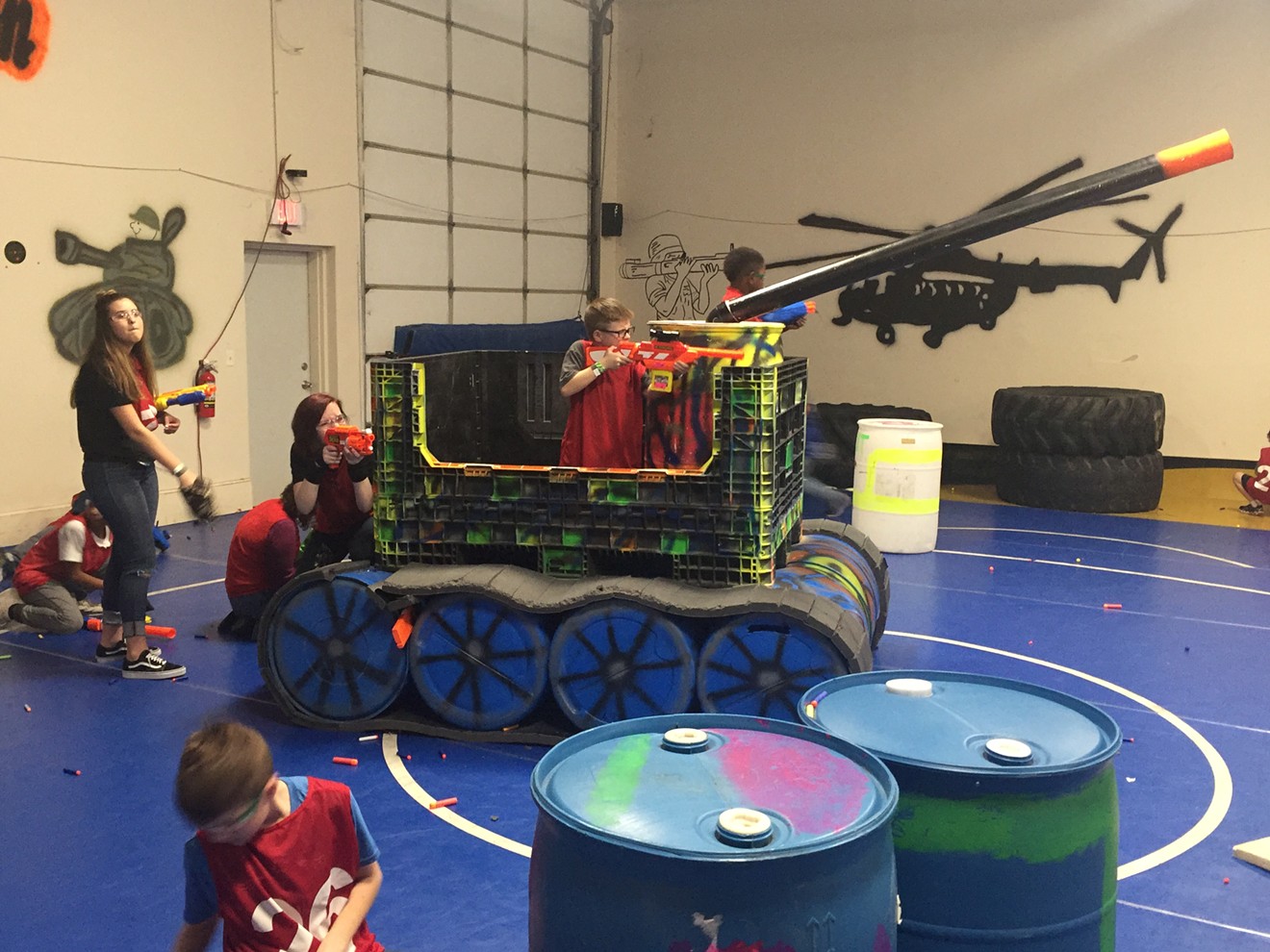 A team of Nerf warriors holds its position in a mock tank at The Battlefield, a facility in Denton that pits teams of Nerf toting warriors against each other every weekend.
