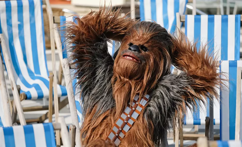 Image: Chewbacca has appeared in some contractually obligated weird shit, thanks to the endless Star Wars spinoffs. Celebrate the whole galaxy far, far away this May 4.