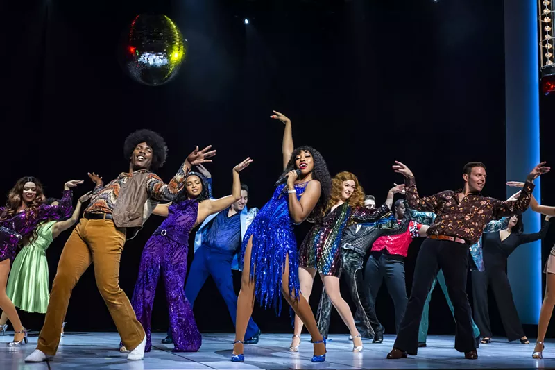 Image: (center) Charis Gullage (“Disco Donna”) and the ensemble of Summer perform "Hot Stuff"