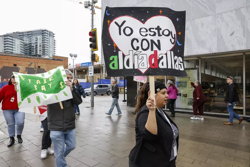 Image: Staff members of The Dallas Morning News set up a picket line outside the newspaper's headquarters Tuesday morning.
