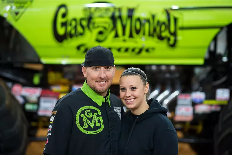 Image: Driver B.J. Johnson and crew chief Lindsey Hilgendorf pose in front of the Gas Monkey Garage truck.
