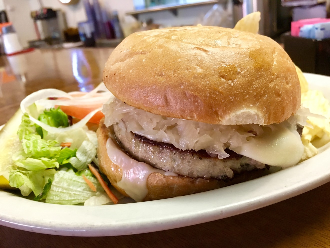 The German Burger at Henk's European Deli, with Swiss cheese and sauerkraut, is $7.25.