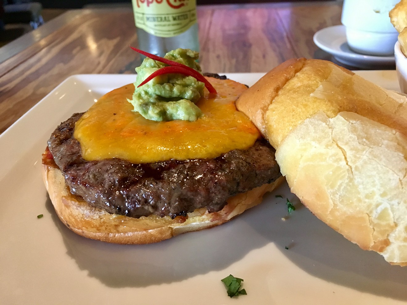 The "Andes Burger" with a scoop of avocado mash and rocoto pepper slivers for $13.50.