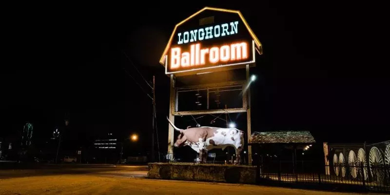 Image: The neon sign of the historic Longhorn Ballroom shines bright again thanks to a recent restoration project that will help the music venue open its doors by the spring.