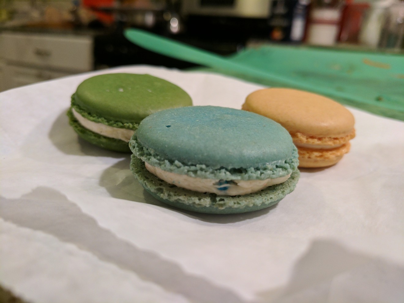That, front and center, is the Fruity Pebbles flavor from Chelles Macarons. The backup dancers are pistachio and lemon.