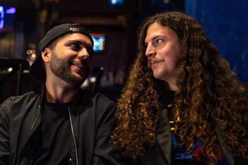 Image: Musicians Doug McKenna (left) and Patrick Smith (right) hang out before an Omega Station show.