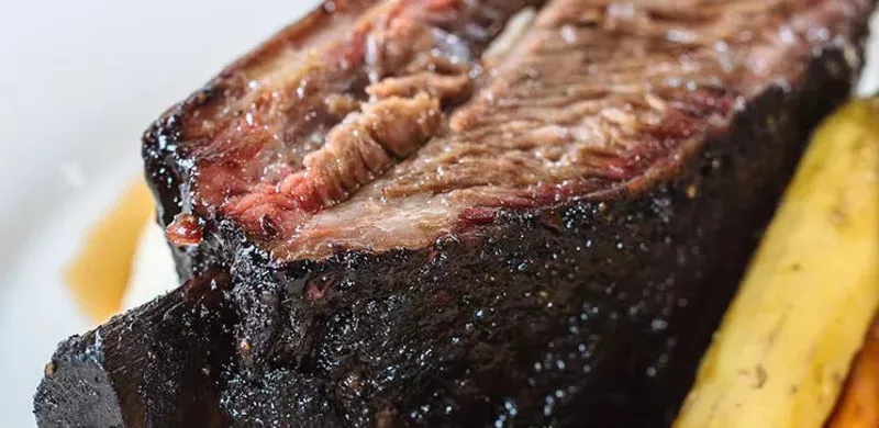 Image: Brontosaurus bone smoked short rib with Parmesan mash, roasted asparagus and au jus.