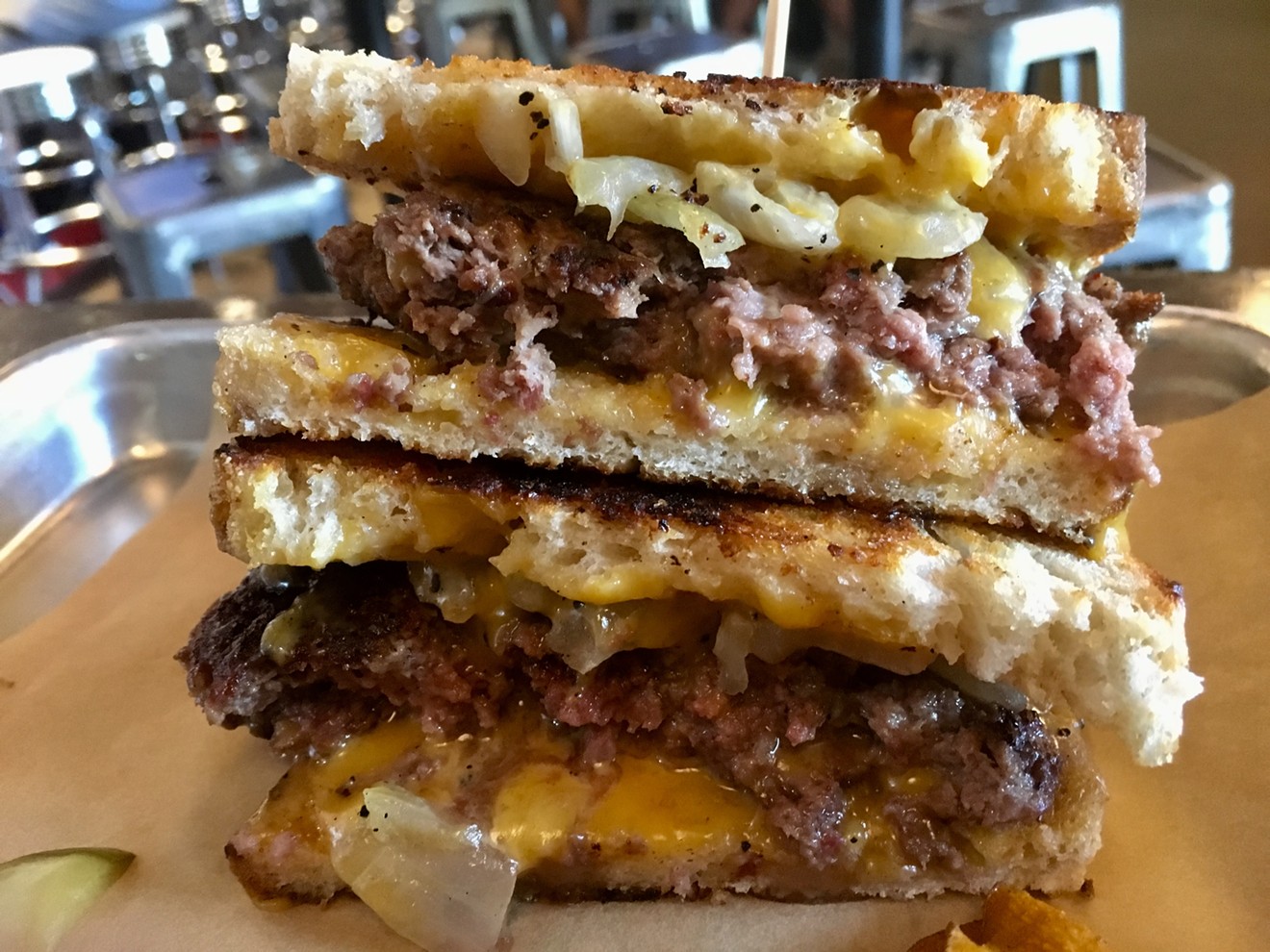 The famous patty melt at the Parlor on Commerce is back, but you'll find it a few blocks away.
