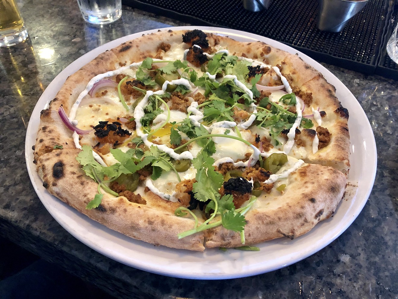 The breakfast taco pizza ($16) at Cane Rosso in Deep Ellum