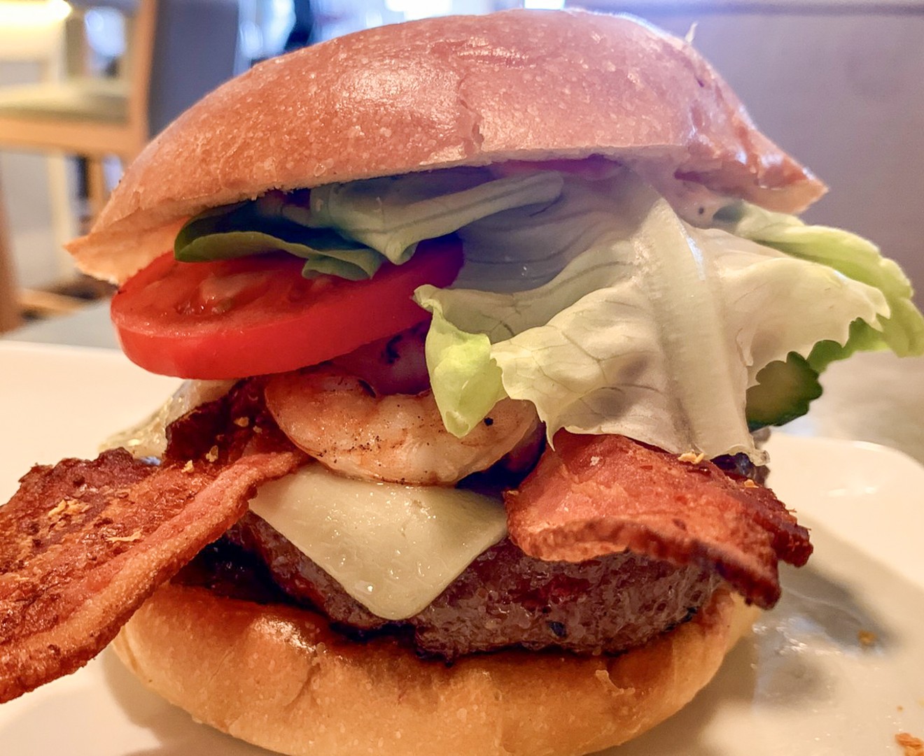 The yacht club burger with bacon, white cheddar, lettuce, tomato, onion and fresh pickles for 16 bucks. Add grilled shrimp — yes, do this — for $5.