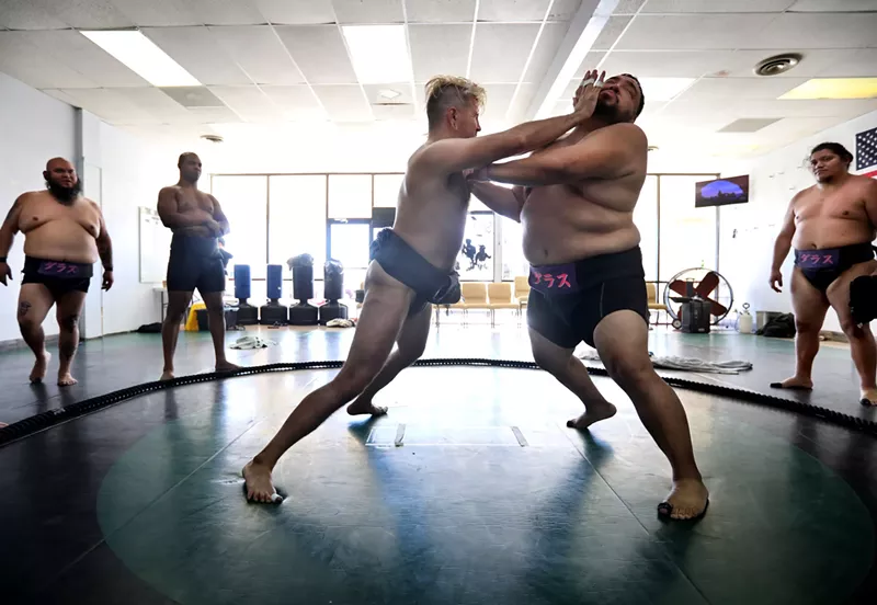 Image: Dallas Sumo Club founder Corey Morrison engages with Obie Centeno at the Arlington School of Self Defense.