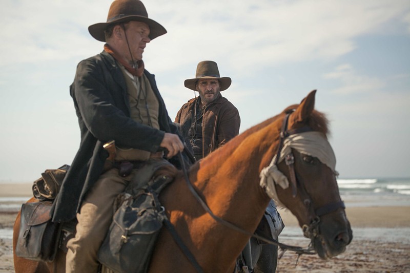 John C. Reilly (left) plays Eli and Joquain Phoenix is Charlie in  The Sisters Brothers, French director Jacques Audiard's film that brings something fresh to a Western — a genuine depiction of sibling love.