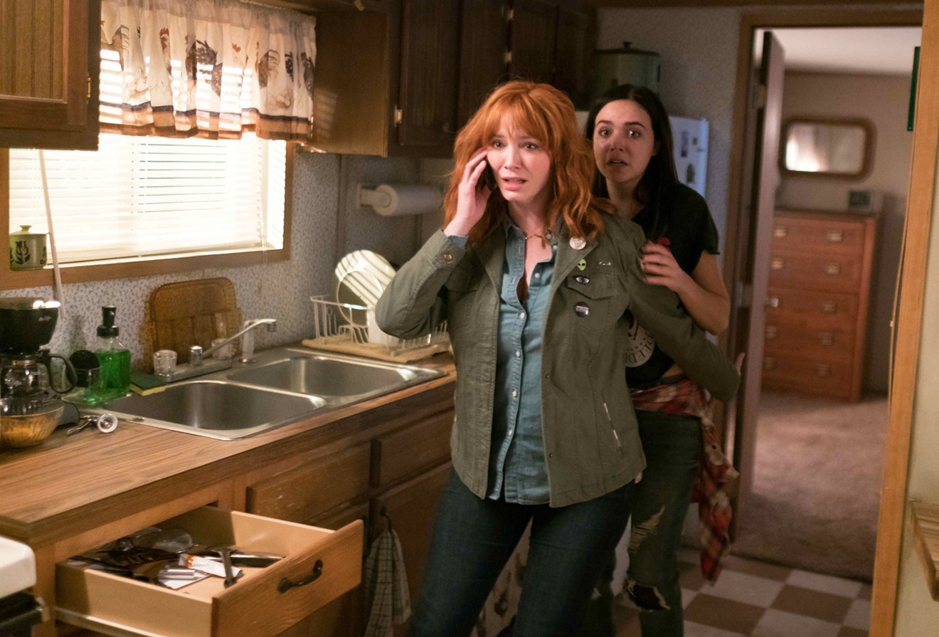 Christina Hendricks (left) plays Cindy, the mother of a rebellious teenage daughter named Kinsey (Bailee Madison) in a family that gets terrorized by a murderous trio in The Strangers: Prey at Night.