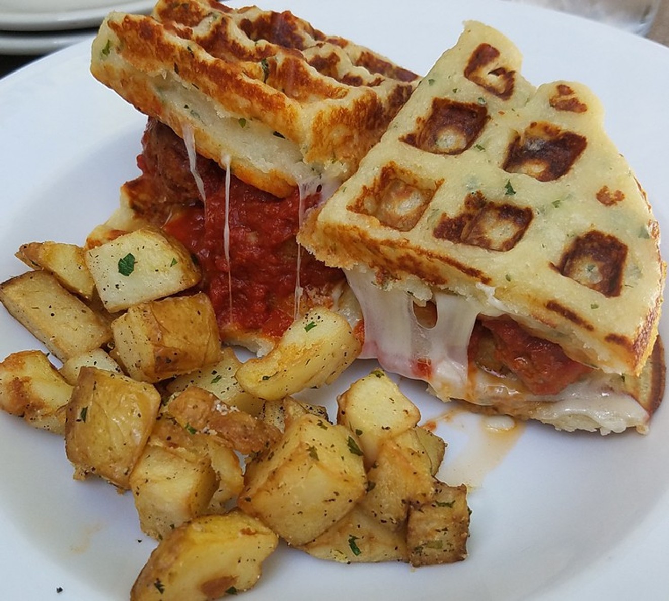 This Cane Rosso creation is no ordinary waffle. It is a savory, potatoey waffle — think part pierogi, part mashed potato pancake — stuffed with meatballs, cheese and tangy sauce.