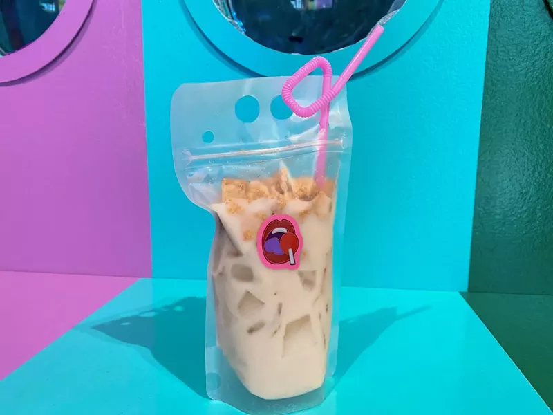 Image: The Cinnamon Toast Pouch made with cinnamon-y vodka and almond milk, topped with a scoop of cereal.