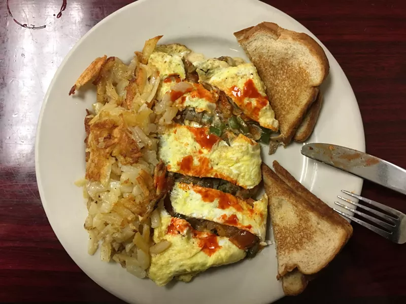 Image: A stupendous, cheesy gyro omelette with hash browns and toast for $9.95.