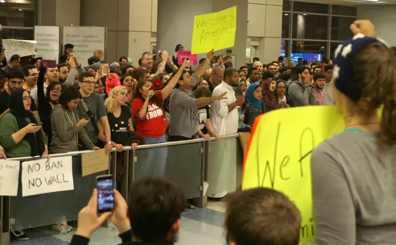 Image: "They Were Told They Would Have to Go Back": Immigration Order Sparks Chaos, Protests at DFW International