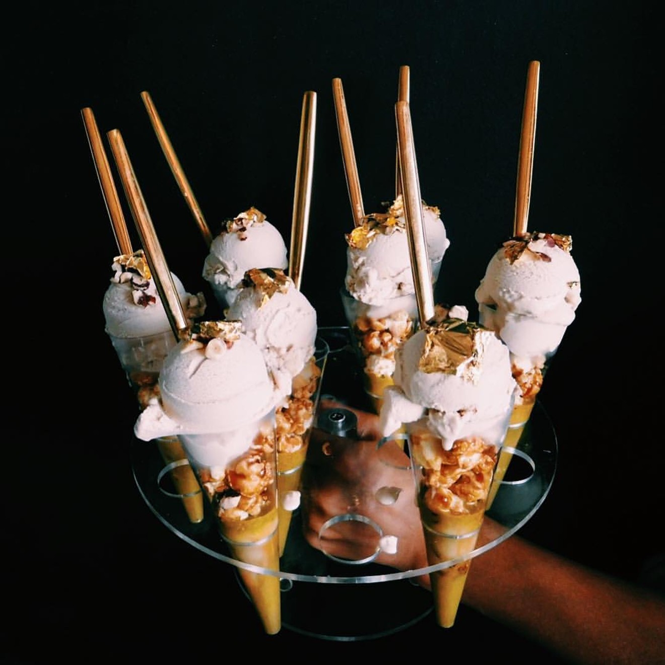 From one of Ice Cream Wasted's tasting menus: organic coconut milk ice cream with white chocolate, cream soda, white fudge and vanilla bourbon bean atop a cone filled with roasted hazelnuts and 24-karat gold and topped ridiculously with 24-karat gold hazelnut syrup and brown-buttered popcorn