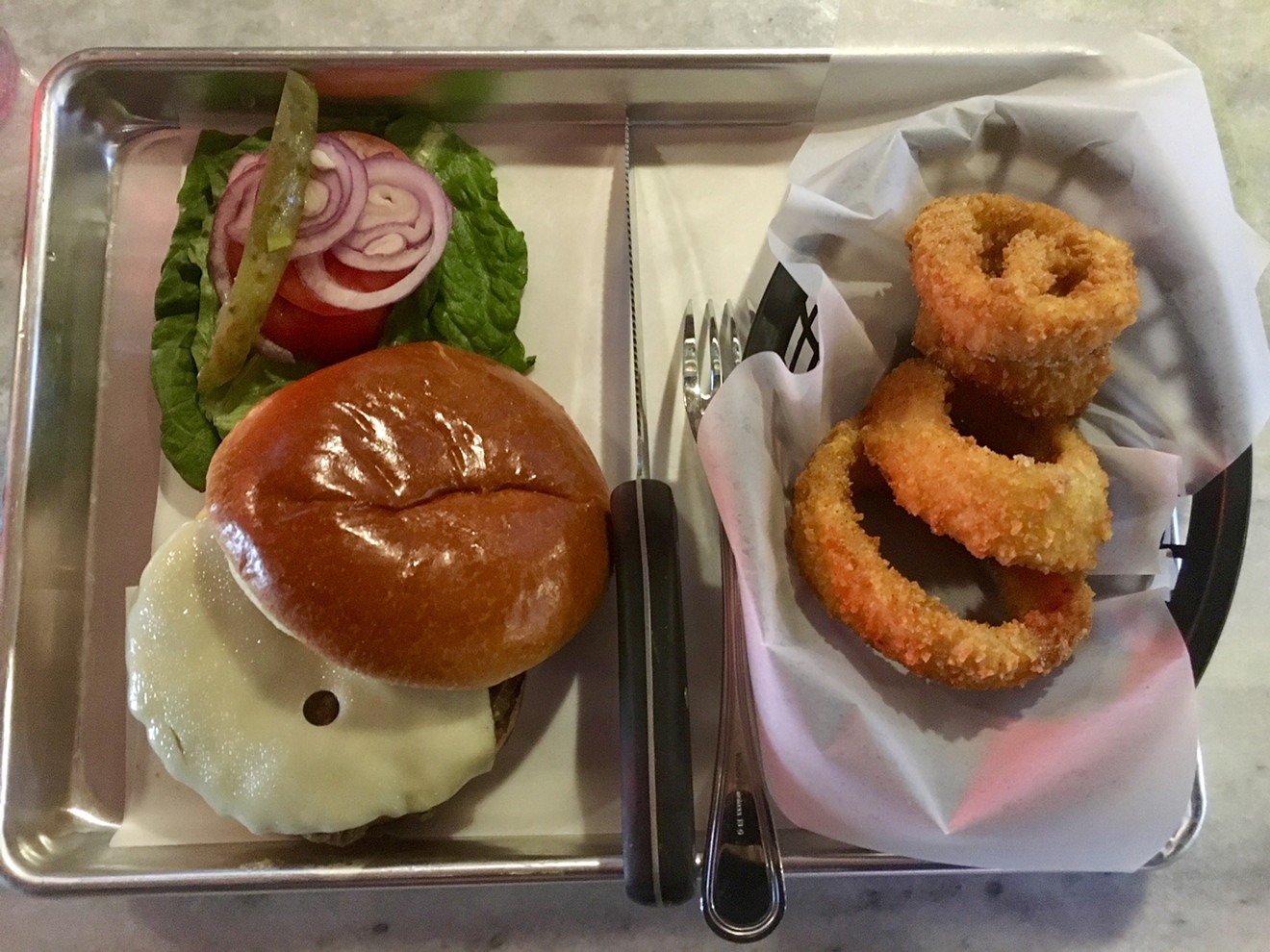 The Bison Burger with Swiss cheese and onion rings at the Bison Bar and Grill for $13.50