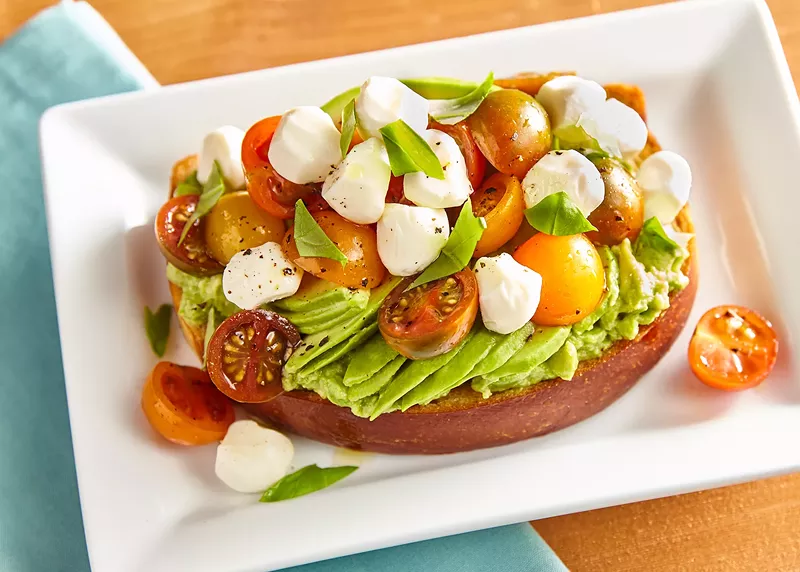 Image: We really did need another avocado toast option. This one is a caprese toast, one of six styles of avocado toast served at the new Trinity Groves concept.