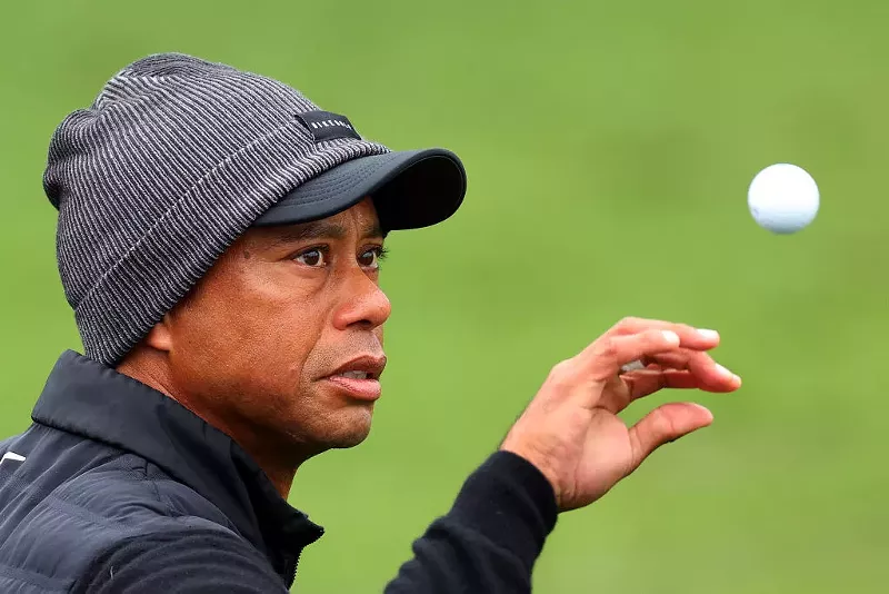 Image: Tiger Woods catches a ball on the practice area during the third round of the 2023 Masters Tournament at Augusta National Golf Club on April 08, 2023, in Augusta, Georgia.