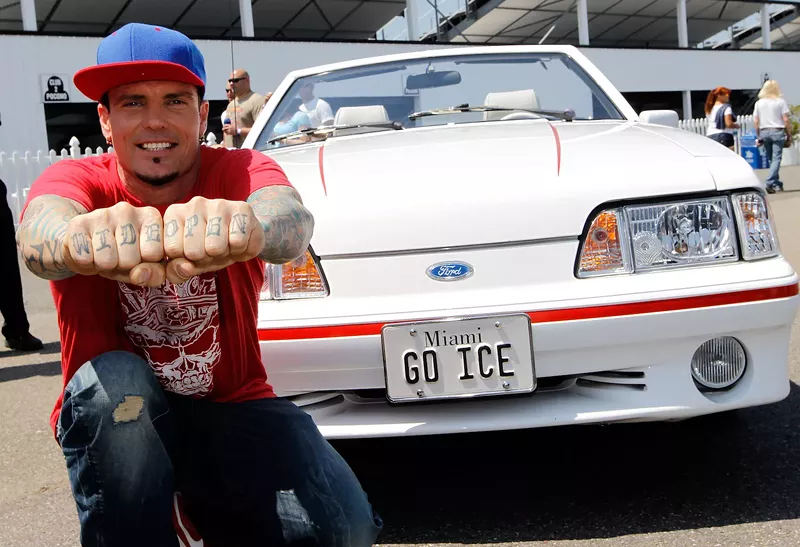 Image: Vanilla Ice with a vintage Mustang before the start of the 2012 NASCAR Sprint Cup Series at Pocono Raceway in Long Pond, Pennsylvania.