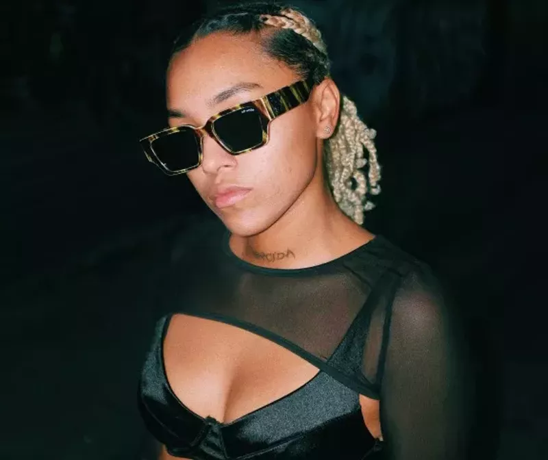 Image: Dallas singer Alex Irish in dark sunglasses. The artist has a new EP.