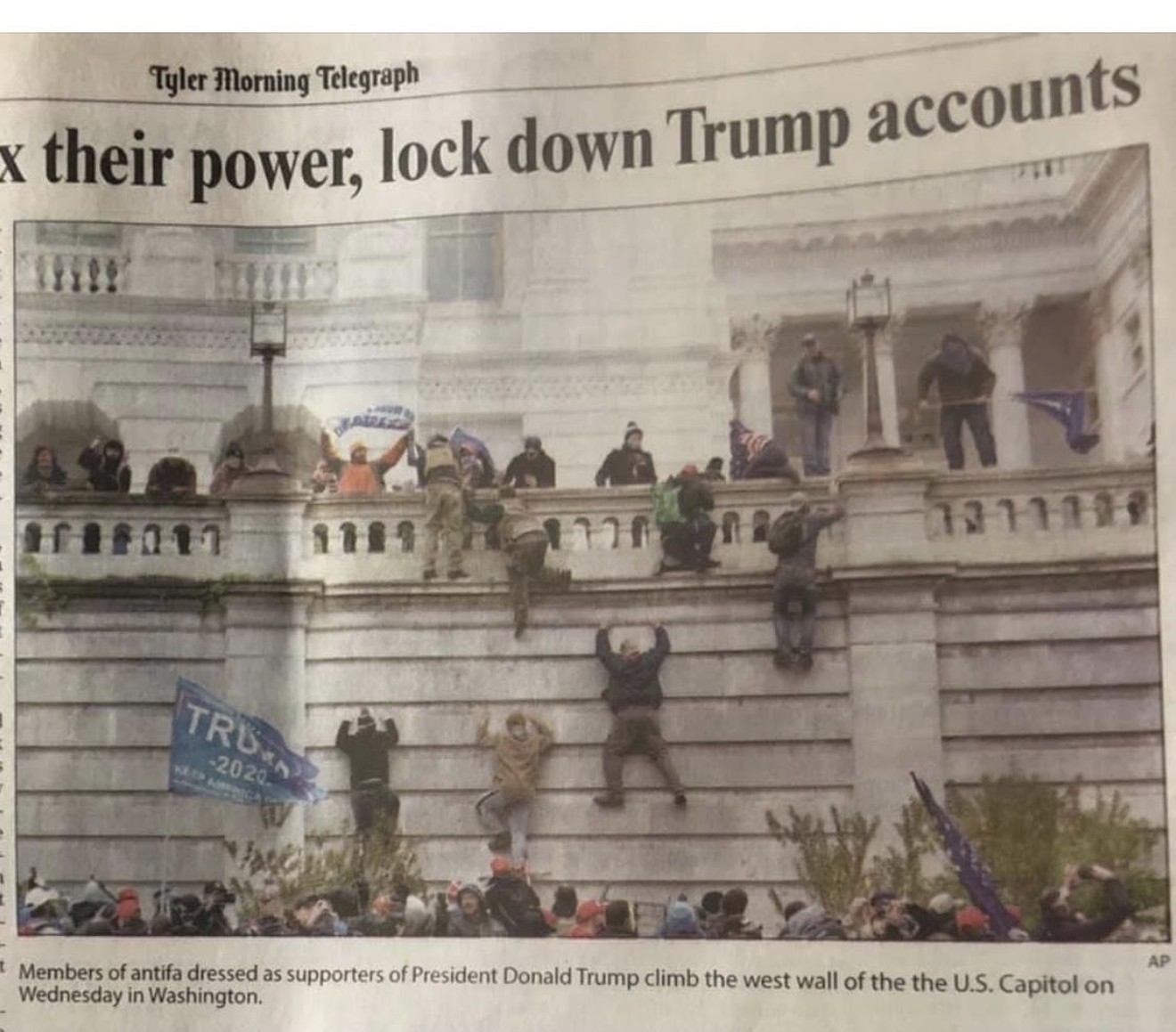 Editors at the Tyler Morning Telegraph were hammered by readers after the paper's Friday edition included this photo of rioters at the Capitol along with a caption peddling a false claim they were members of antifa.