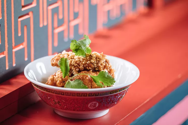 The crab fat caramel chicken wings have proven to be one of Hot Joy's most popular dishes. - KATHY TRAN