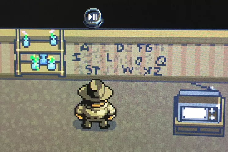 Police Chief Hopper stares at the lighted alphabet wall that Will's mom uses to communicate with her missing son. - SCREENSHOT BY DANNY GALLAGHER